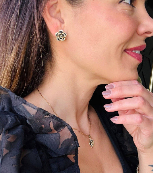 Black Camellia earrings in gold